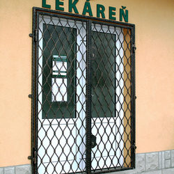 Wrought-iron grilles Wave on the door of a pharmacy in Levoa