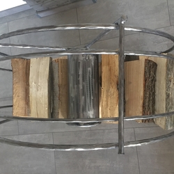 Aforged wheel-shaped log holder  an original storage space for wood  view from above
