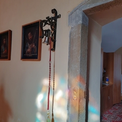 A wrought iron bell holder by the church door - Tvaron (Slovakia)