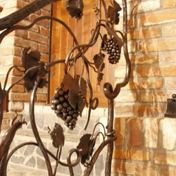 A hand-forged railing like a vine in a wine cellar - artistic design