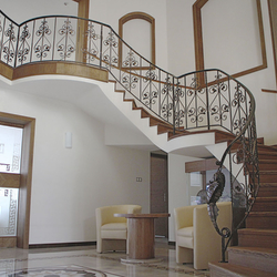 A curved wrought iron railing