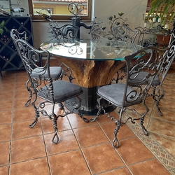Designer table made from oak tree trunk, with hand forged chairs – stylish furniture