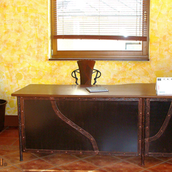A wrought iron desk