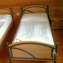 A wrought iron bed wood - metal combination