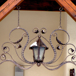 A wrought iron lamp - house entrance