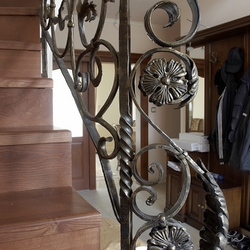 Detail of an interior staircase railing – forged railing by UKOVMI