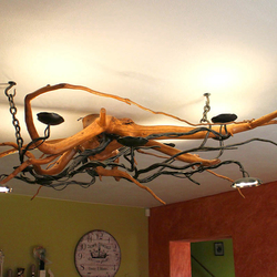 A wrought iron chandelier - A  hanging light